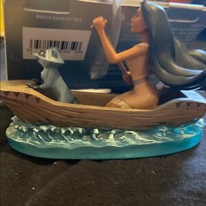 Disney Pocahontas and Meeko in Canoe with Blue Waves